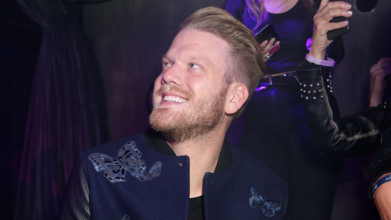 Scott Hoying smiling in a suit