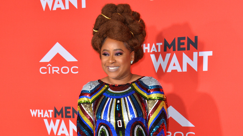 Phoebe Robinson against red backdrop