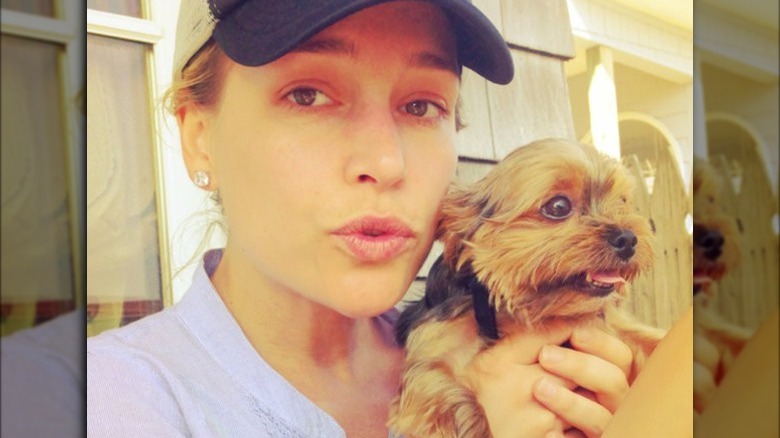 Piper Perabo holding a dog