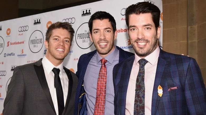 Property Brothers Jonathan Scott and Drew Scott with their brother J.D. Scott