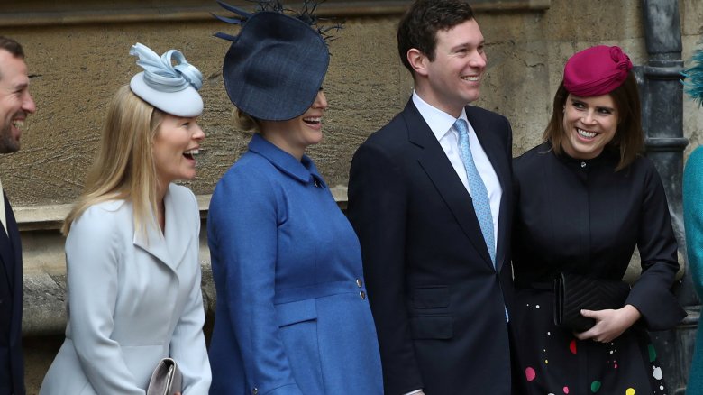 Zara Tindall with a baby bump, laughing with family members