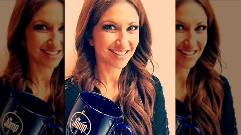 Rachel Nichols with a mug