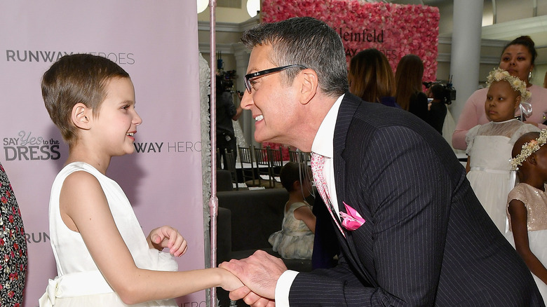 Randy Fenoli with a young girl