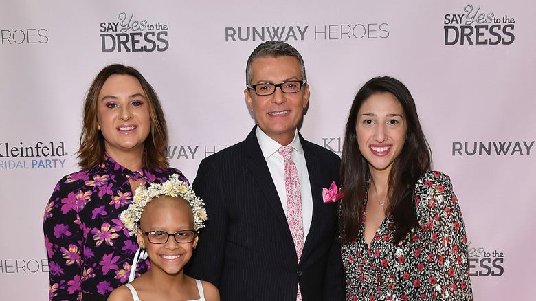 Randy Fenoli at the Runway Heroes event in 2018 with women and girls