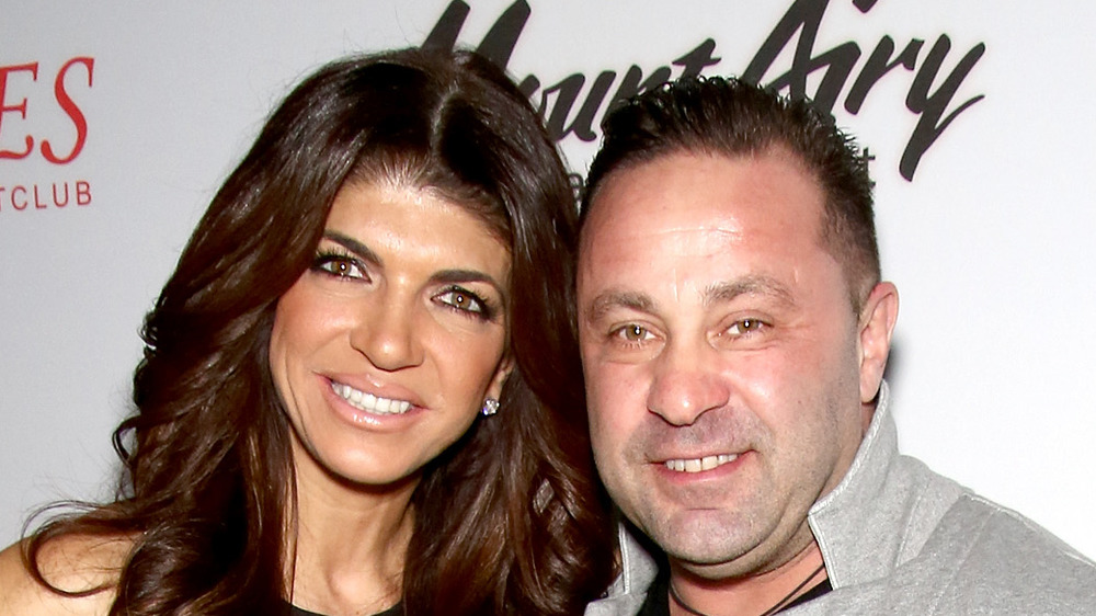 Teresa and Joe Giudice pose at a book signing