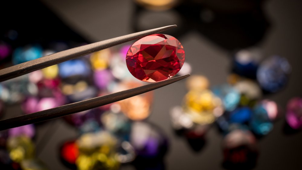 Jeweler holding synthetic ruby