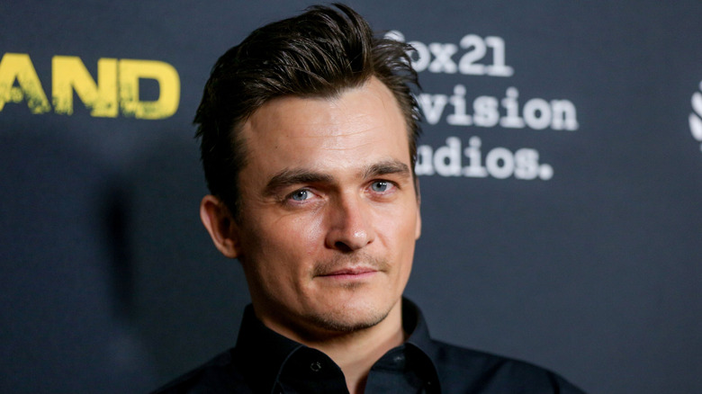 Rupert Friend smiling slightly