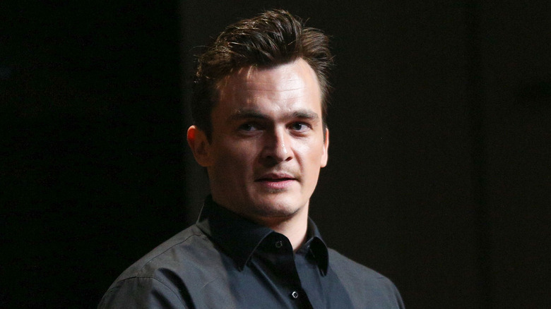 Rupert Friend black shirt 