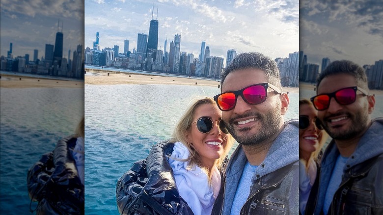 Emily Wilson and Shake Chatterjee smiling by the water