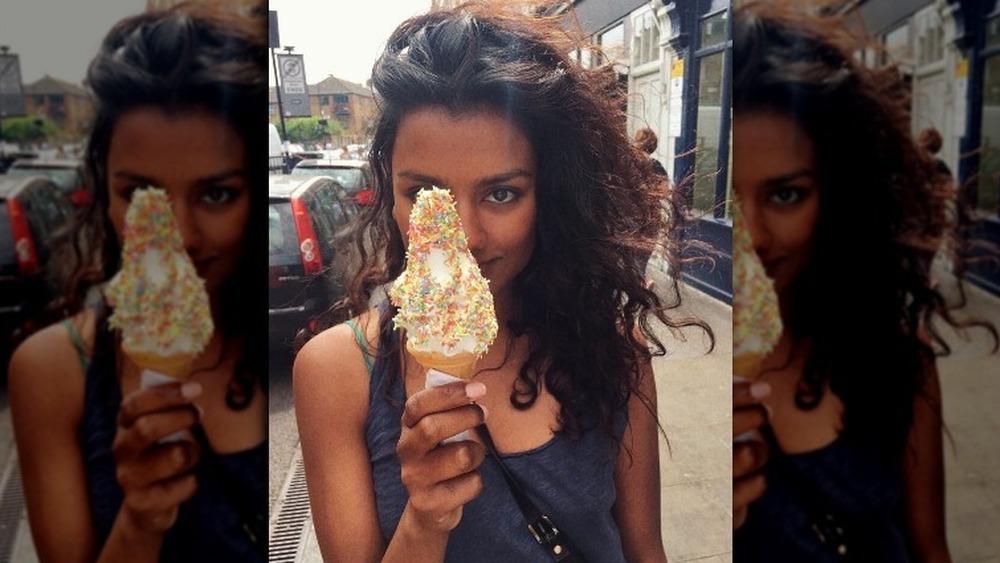 Simone Ashley holding an ice cream cone