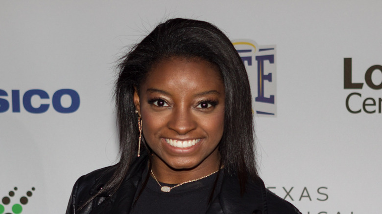 SImone Biles wearing a black top