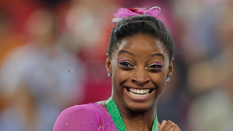 Simone Biles and a bee