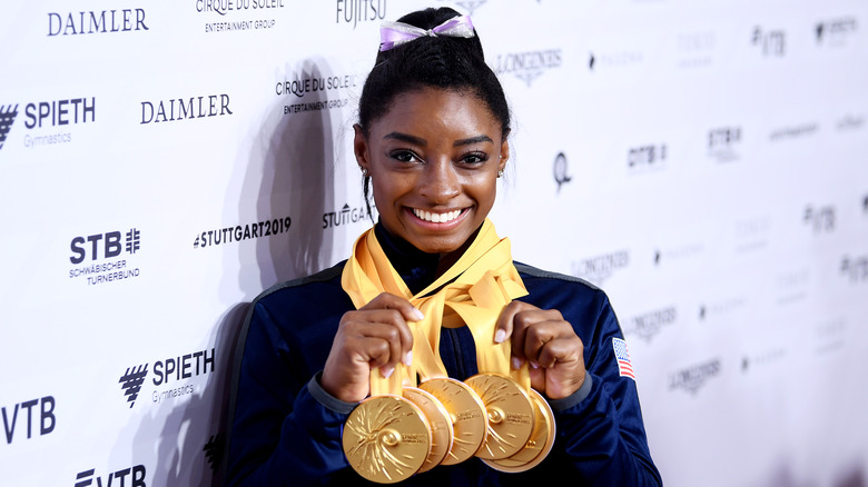 Simone Biles with gold medals