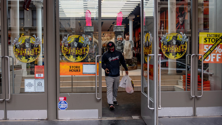 Man walks out of Spirit Halloween