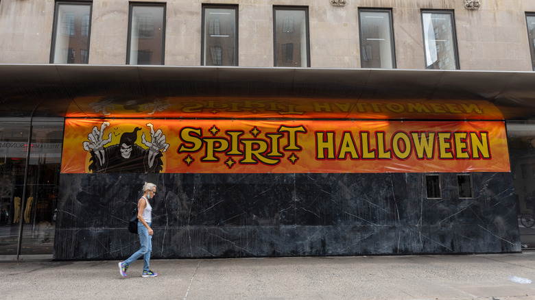 Person walks in front of Spirit Halloween 