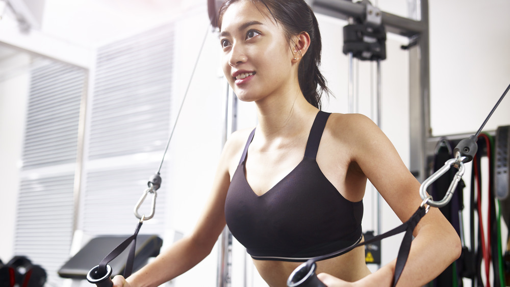 A woman in sports bra exercising