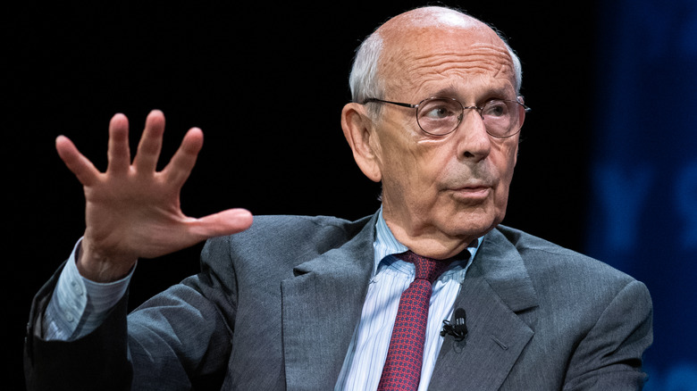 Stephen Breyer holding hand up