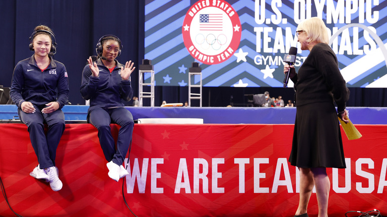 Sunisa Lee being interviewed with Simone Biles