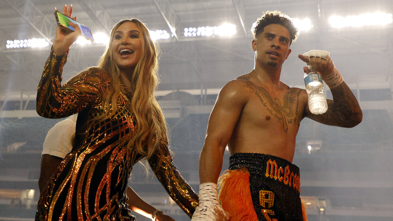 Catherine Paiz and Austin McBroom waving to a crowd