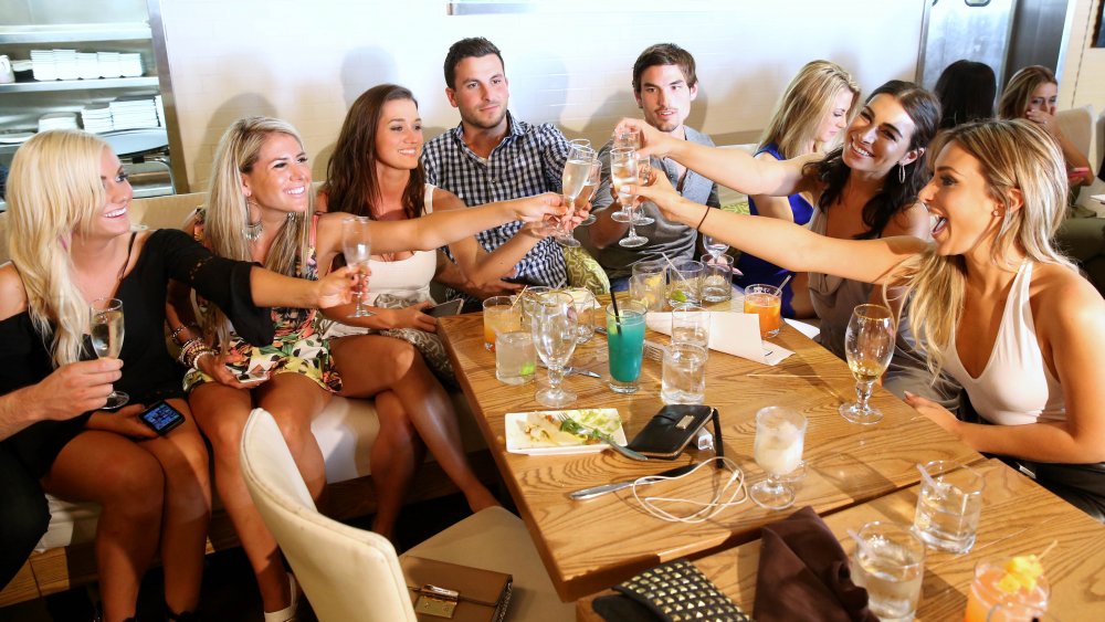 Contestants from The Bachelor eating and drinking