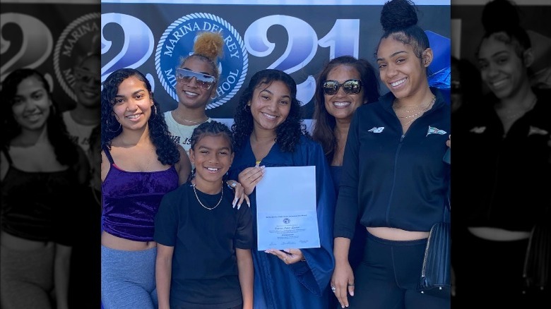 Aaron D. Spears five kids and wife smiling at a graduation