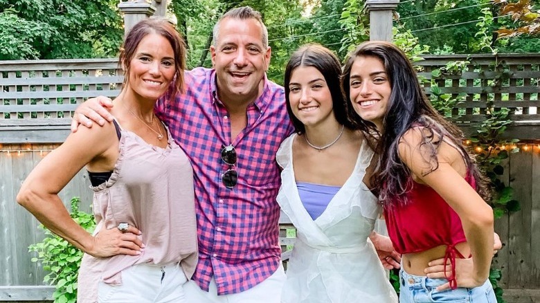 The D'Amelio family outside in a yard