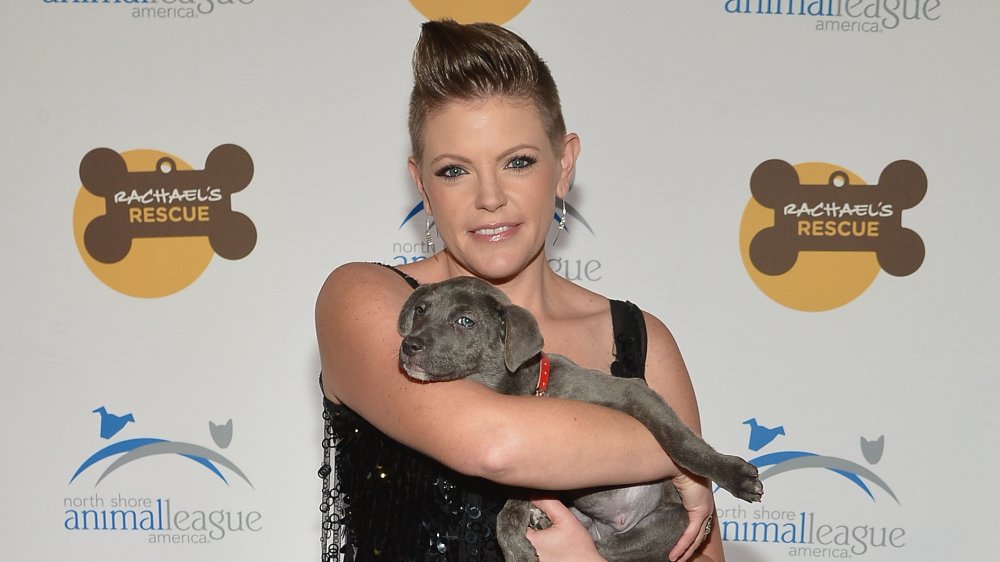 Natalie Maines of the Dixie Chicks holding a puppy in 2013