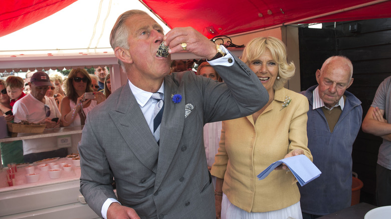 Prince Charles eating an oyster