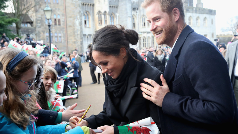 Meghan Markle signing autograph in Cardiff, Wales