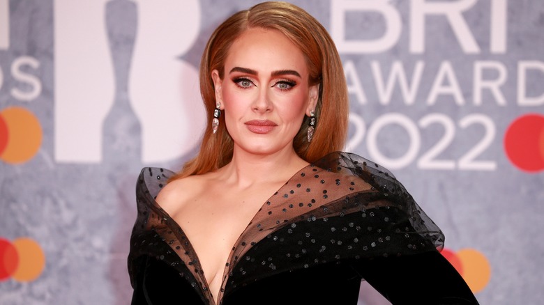 Adele wearing a black dress 