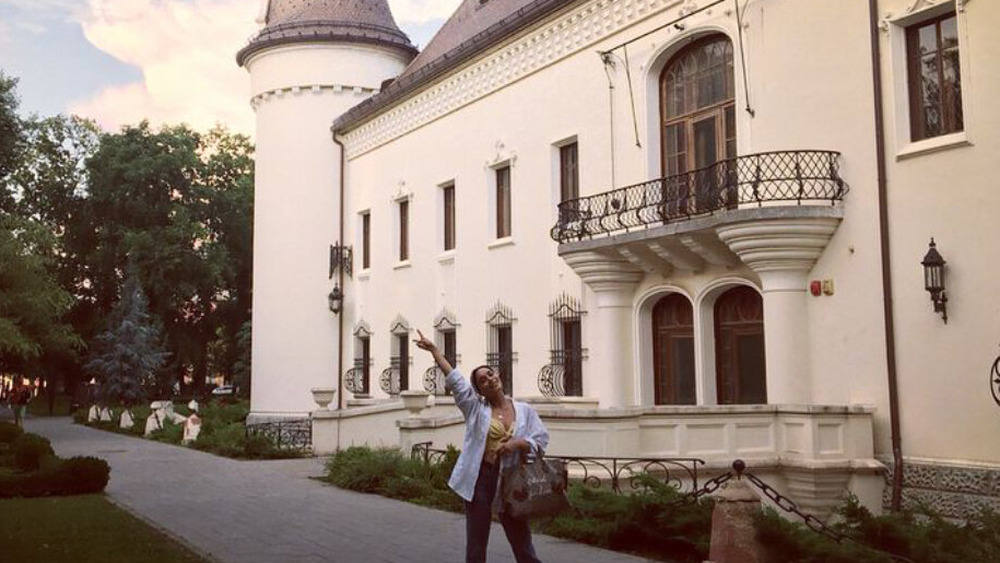 Vanessa Hudgens outside of a building in Romania