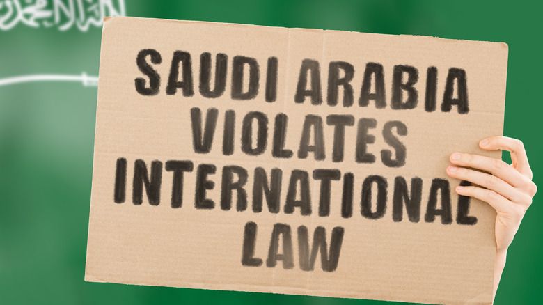 banner protesting Saudi Arabia's laws