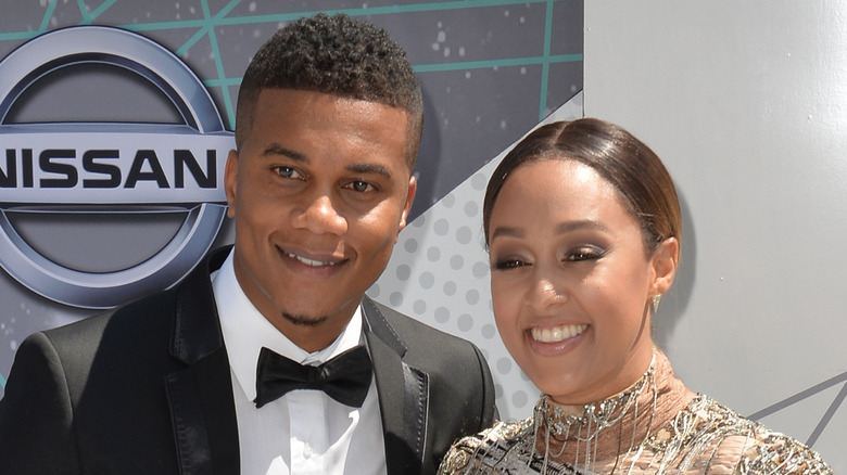 Tia Mowry posing with her husband, Cory Hardrict