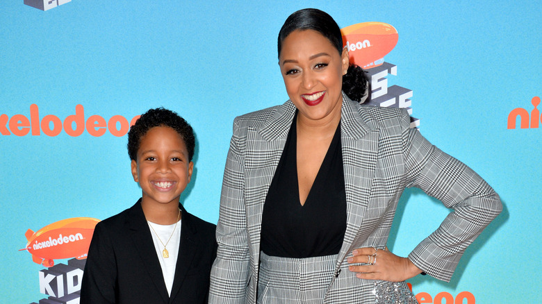 Tia Mowry posing with her son