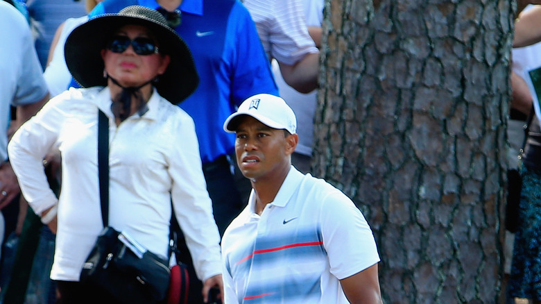 Kultida Woods watches as Tiger Woods plays