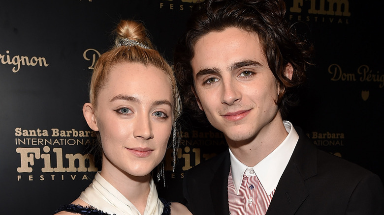 Timothée Chalamet in pinstriped shirt with Saoirse Ronan 