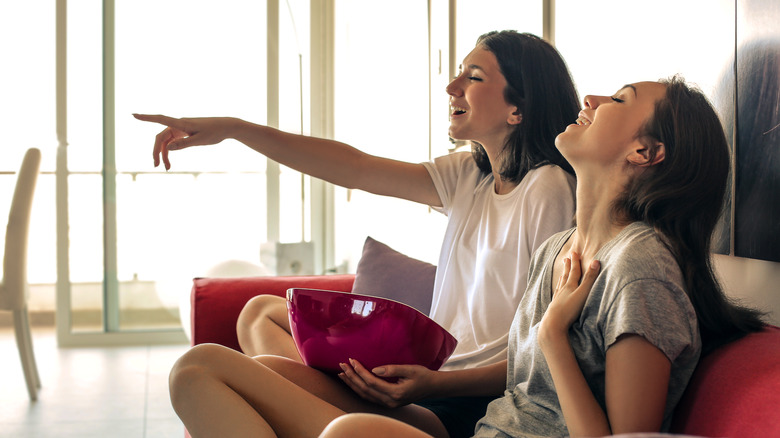 teen girls watching TV