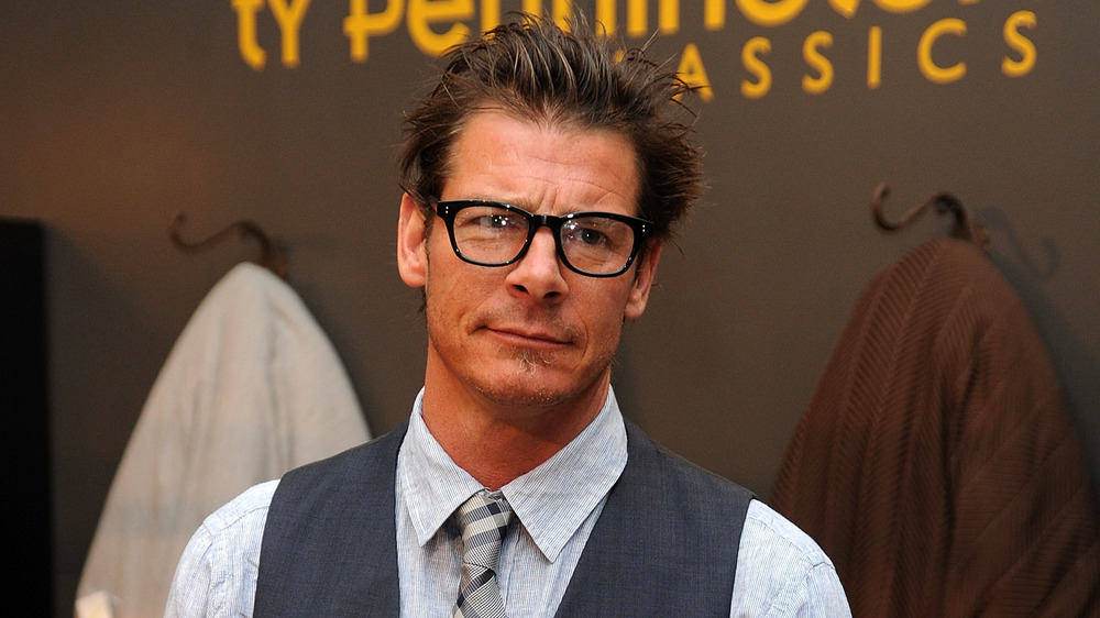 Ty Pennington wearing glasses and a vest