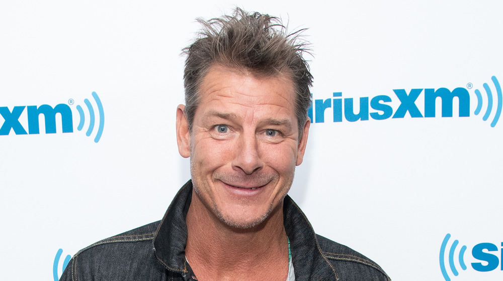 Ty Pennington holding his book