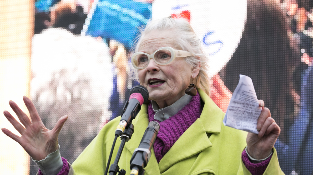 Vivienne Westwood wearing green and magenta, speaking