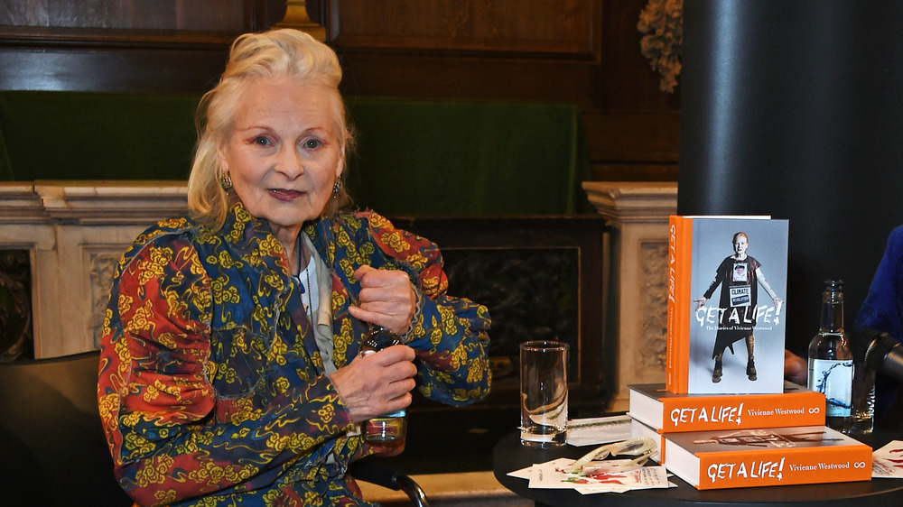 Vivienne Westwood posing with her book