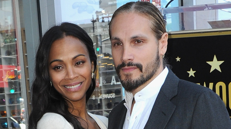 Zoe Saldana and Marco Perego posing