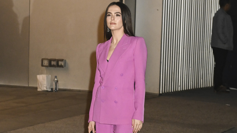 Zoey Deutch in a pink suit