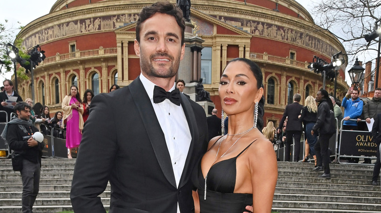 Thom Evans and Nicole Scherzinger attending The 2024 Olivier Awards