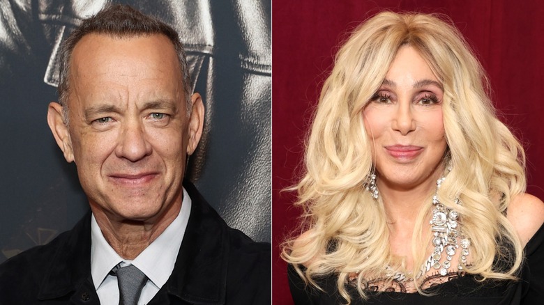 Tom Hanks poses for the camera & Cher poses for the camera