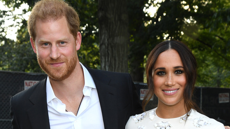 Prince Harry and Meghan Markle smiling