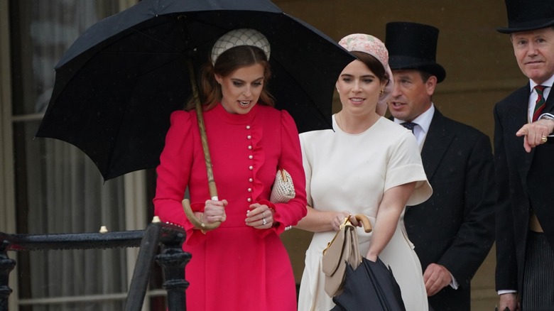 Princess Beatrice Princess Eugenie smiling, walking