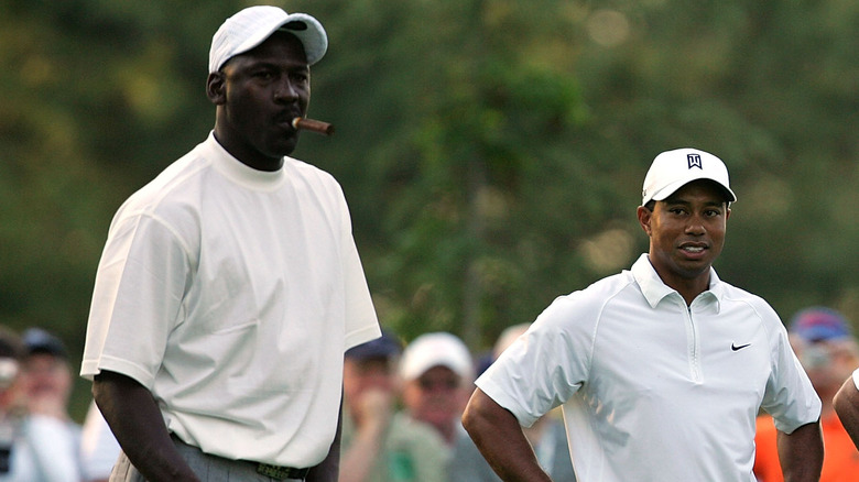 MIchael Jordan smoking cigar, Tiger Woods looking