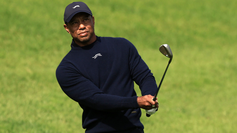 Tiger Woods swinging a golf club 