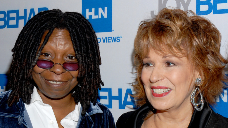 Whoopi Goldberg and Joy Behar smiling on the red carpet